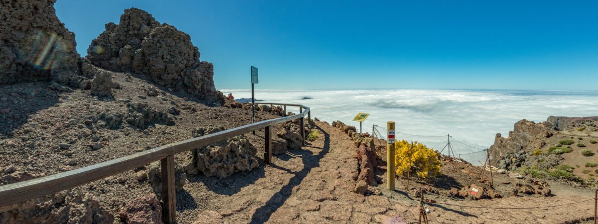 Fish eye Panorama of the National Park Caldera de Taburiente, volcanic crater seen from mountain peak of Roque de los Muchachos Viewpoint. Tenerife and El Hierro above the clouds. La Palma, Spain.